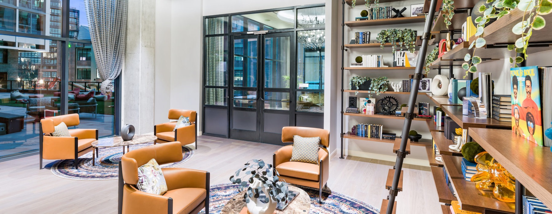 Floor to ceiling library with ample seating area