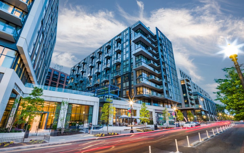 City street view of exterior of building and retail