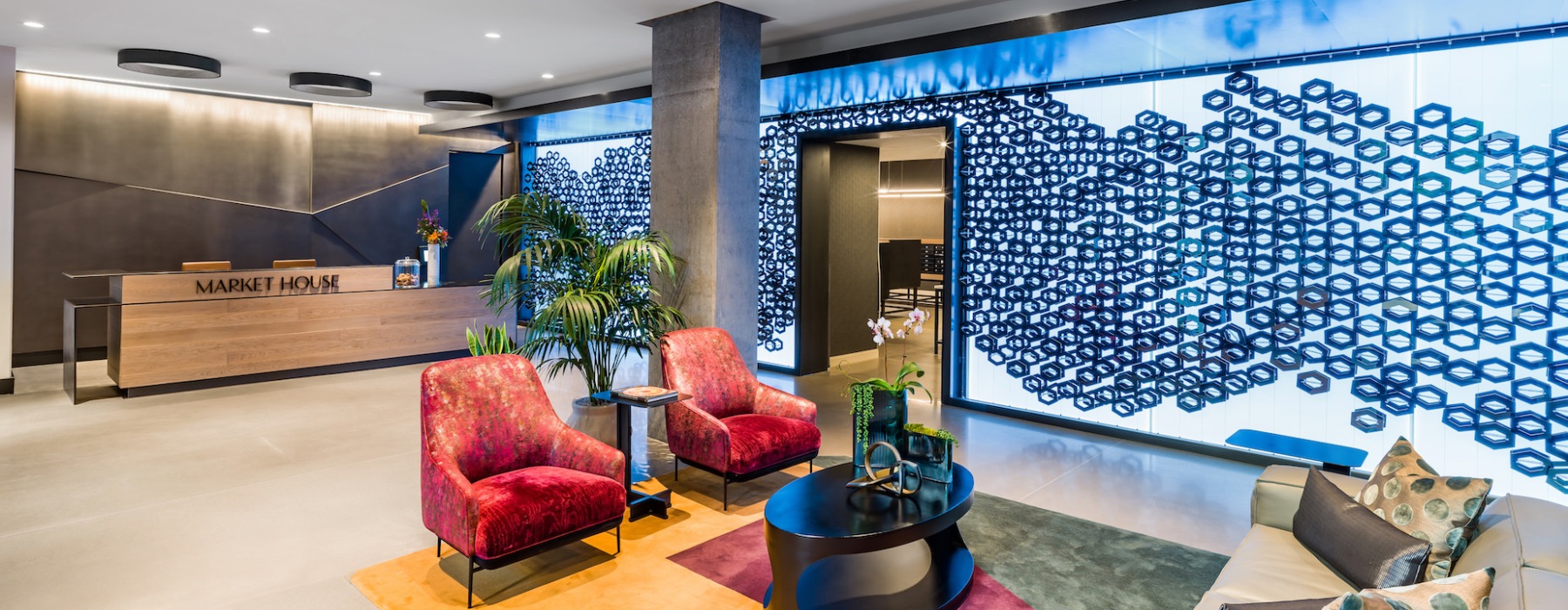 Market House lobby with front desk and vibrant seating 